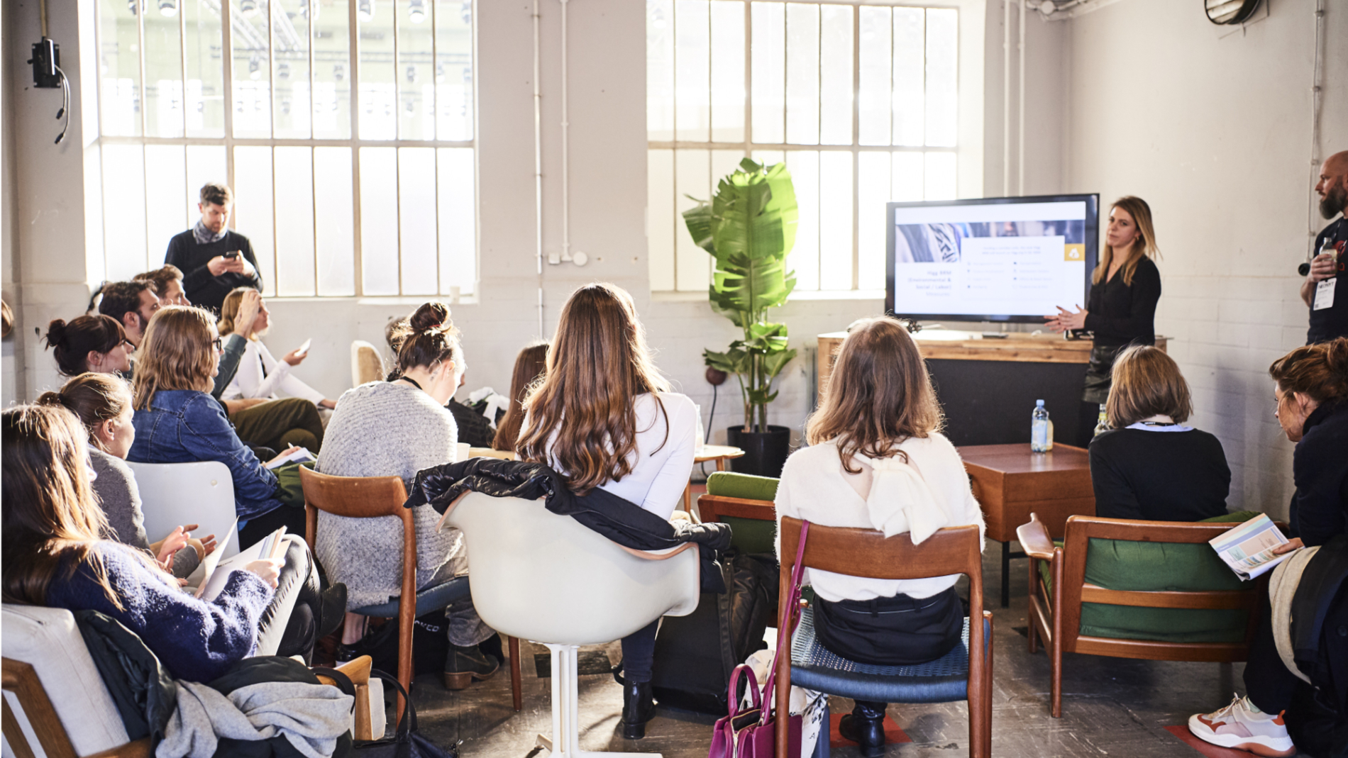 Young people listen to a lecture at the Fashionsustain (Neonyt)