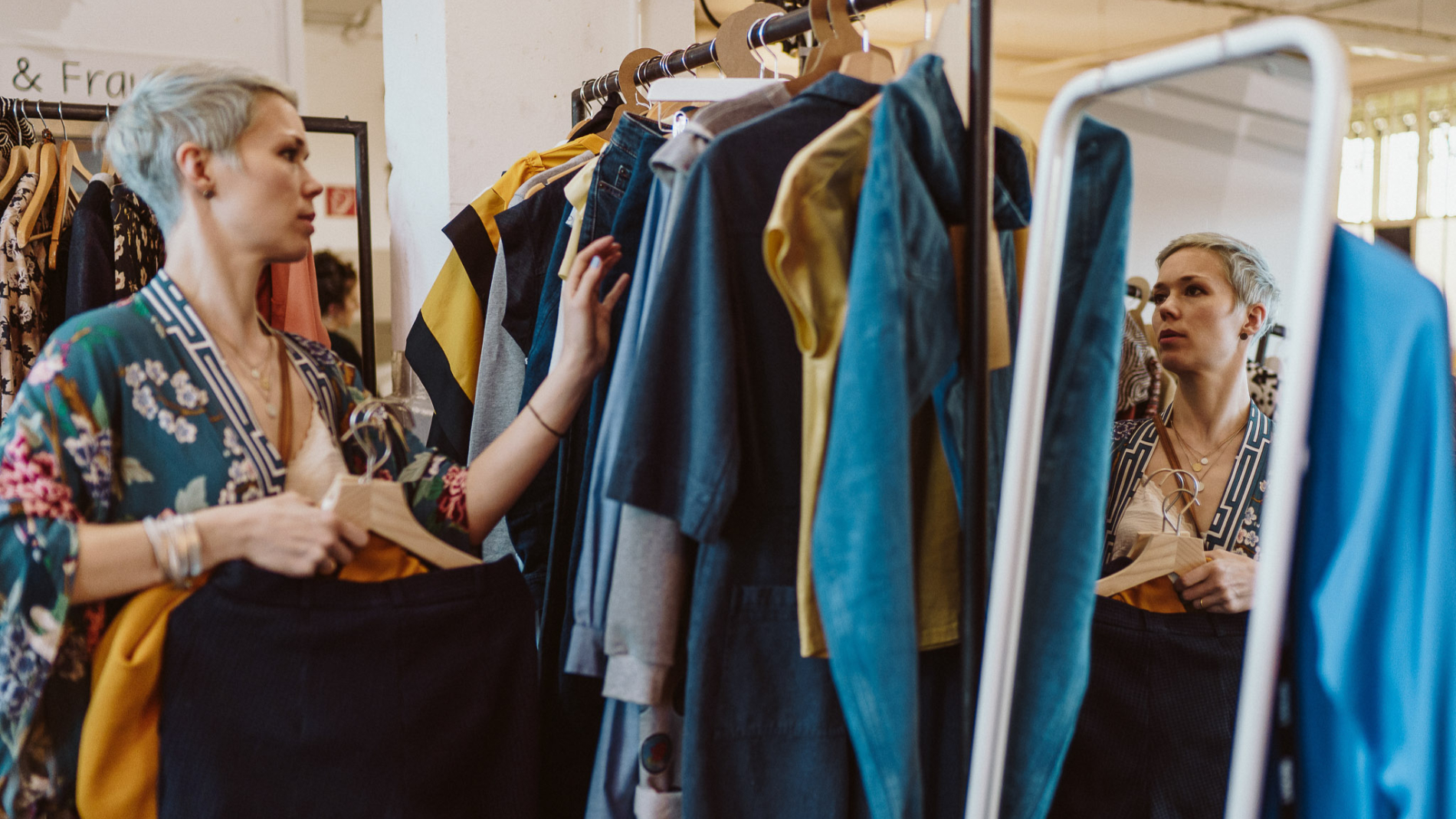 A woman looks for clothes at the Prepeek, the content creator area of Neonyt